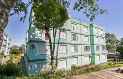 Amplo apartamento de 3 dormitórios com garagem coberta