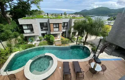 Casa em condomínio fechado com 3 quartos para alugar na rua laurindo januário da silveira, canto da lagoa, florianópolis, 246 m2 por r$ 16.900