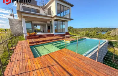 O seu refúgio está aqui! residência de alto padrão no reserva amary - design contemporâneo, lazer privativo e vista deslumbrante na enseada azul.