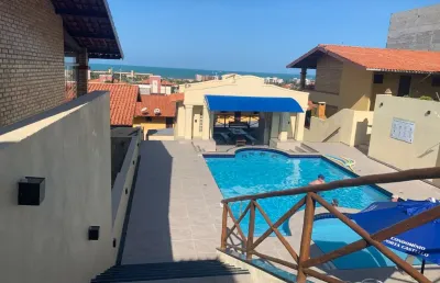 Casa duplex com 2 suítes em condomínio na praia do porto das dunas, ce