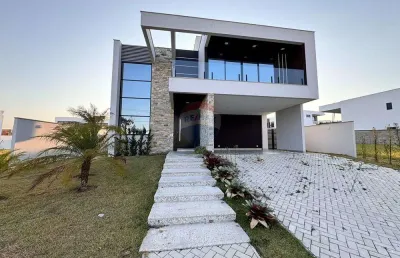 Fachada imponente, área gourmet integrada e 4 suítes, sua casa dos sonhos em alphaville.