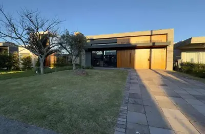 Casa em condomínio fechado com 4 quartos à venda na rua onório germano, 2009, zona nova, capão da canoa por r$ 1.700.000