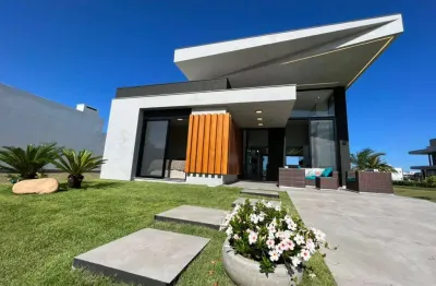Casa em condomínio fechado com 4 quartos à venda na rua rio divisa, 32, centro, xangri-lá, 166 m2 por r$ 1.790.000