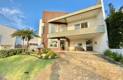 Casa em condomínio fechado com 4 quartos à venda na avenida central, 2000, zona nova, capão da canoa por r$ 2.300.000