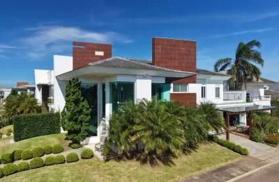 Casa em condomínio fechado com 4 quartos à venda na avenida central, 2000, zona nova, capão da canoa por r$ 3.900.000