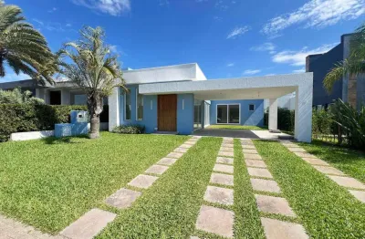 Casa em condomínio fechado com 4 quartos à venda na rua onório germano, 2009, zona nova, capão da canoa, 220 m2 por r$ 1.290.000