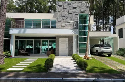 Casa em condomínio fechado com 4 quartos à venda na avenida central, 1510, atlântida, xangri-lá por r$ 2.650.000