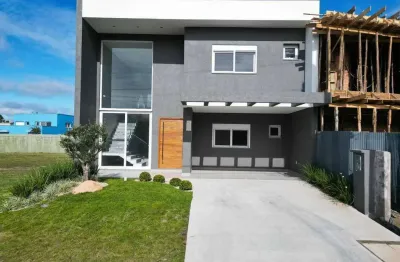 Casa em condomínio fechado com 4 quartos à venda na rua rio divisa, 34, centro, xangri-lá por r$ 2.290.000