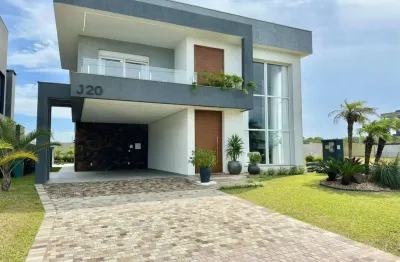 Casa em condomínio fechado com 5 quartos à venda na avenida paraguassu, 1570, capão novo, capão da canoa por r$ 2.930.000