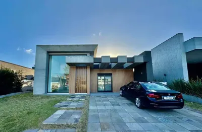 Casa em condomínio fechado com 4 quartos à venda na rua onório germano, 2009, zona nova, capão da canoa, 180 m2 por r$ 1.680.000