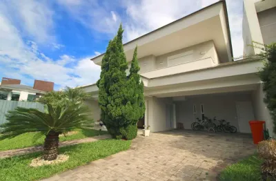 Casa em condomínio fechado com 5 quartos à venda na avenida central, 2000, zona nova, capão da canoa, 261 m2 por r$ 1.850.000