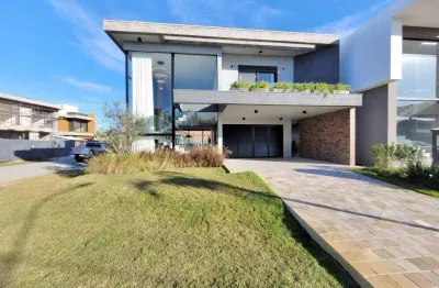 Casa em condomínio fechado com 4 quartos à venda na rua rio divisa, 34, centro, xangri-lá por r$ 2.590.000
