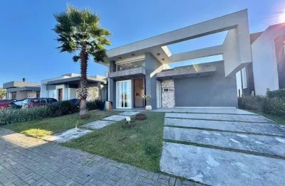 Casa em condomínio fechado com 3 quartos à venda na rua onório germano, 2009, zona nova, capão da canoa, 180 m2 por r$ 1.550.000