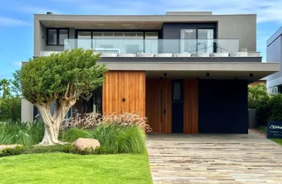 Casa em condomínio fechado com 5 quartos à venda na rua rio jacuí, 1366, centro, xangri-lá, 388 m2 por r$ 7.300.000