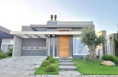 Casa em condomínio fechado com 4 quartos à venda na rua onório germano, 2009, zona nova, capão da canoa por r$ 2.000.000