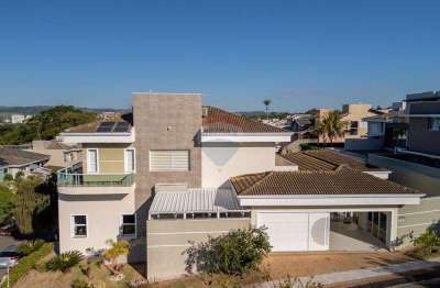 Casa com 4 suítes, espaço gourmet, estúdio, sauna e piscina no condomínio zurich dorf em valinhos/sp