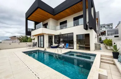 Casa condomínio - condomínio residencial jaguary - 4 dormitórios - 482m².