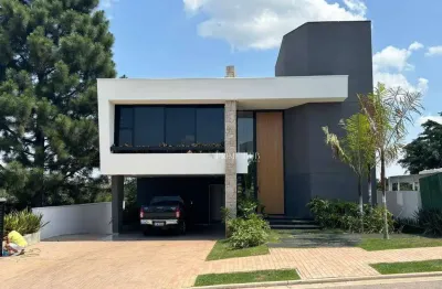Luxuosa casa com 5 suítes e espaço gourmet em condomínio exclusivo