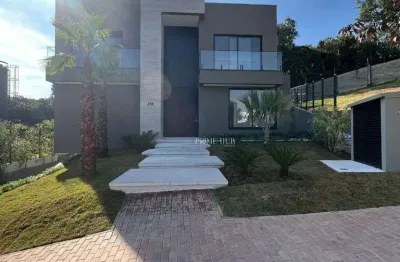 Casa de luxo com 4 suítes, elevador e área de lazer completa com vista para área de preservação permanente no alphaville granja viana