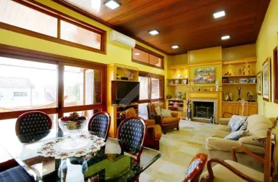 Casa com 4 quartos à venda na rua alcebíades antônio dos santos, 157, nonoai, porto alegre por r$ 1.650.000