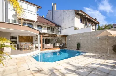 Casa com 4 quartos à venda na alameda afonso celso, 62, boa vista, porto alegre por r$ 4.299.000