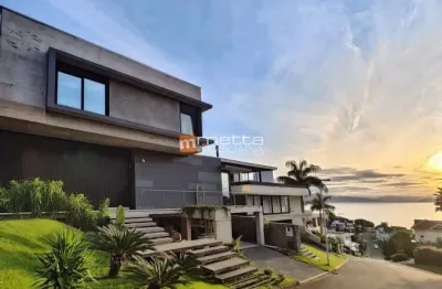 Casa em condomínio fechado com 3 quartos à venda na rodovia haroldo soares glavan, 4940, cacupé, florianópolis por r$ 6.780.000