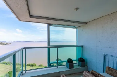 Loft  com sacada living estar e jantar com cozinha americana.