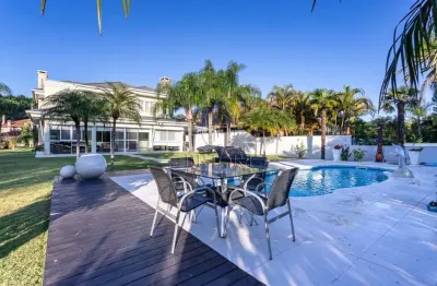 Casa em condomínio fechado com 4 quartos à venda na avenida juca batista, 8000, belém novo, porto alegre por r$ 3.900.000