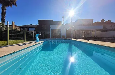 Casa em condomínio fechado com 4 quartos para alugar na avenida juca batista, 9000, belém velho, porto alegre por r$ 18.000