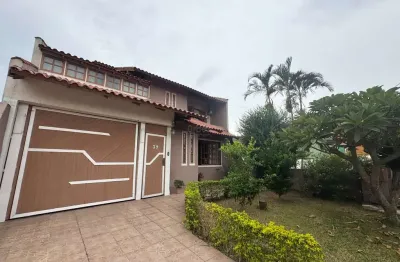 Casa em condomínio fechado com 4 quartos à venda na avenida walter spiess, 39, estância velha, canoas por r$ 990.000