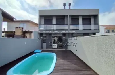 Casa em condomínio fechado com 3 quartos à venda na rua marcílio dias, 184, harmonia, canoas por r$ 699.000