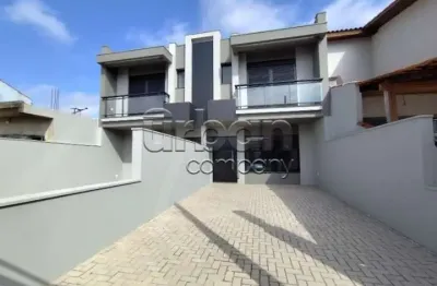 Casa em condomínio fechado com 3 quartos à venda na rua marcílio dias, 180, harmonia, canoas por r$ 699.000
