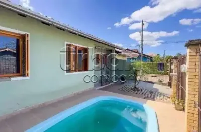 Casa em condomínio fechado com 3 quartos à venda na rua corujas, 437, jardim algarve, alvorada por r$ 310.000