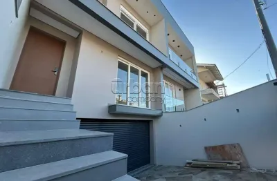 Casa em condomínio fechado com 3 quartos à venda na rua dinamarca, 233, marechal rondon, canoas por r$ 1.450.000