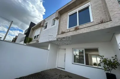Casa em condomínio fechado com 3 quartos à venda na rua ravena, 70, estância velha, canoas por r$ 659.990