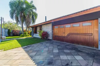 Casa em condomínio fechado com 3 quartos à venda na Rua dos Girassóis, 242, Igara, Canoas por R$ 1.500.000