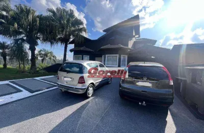 Casa com 4 dormitórios, 502 m² - venda por r$ 3.800.000,00 ou aluguel por r$ 14.000,01/mês - condomínio hills iii - arujá/sp