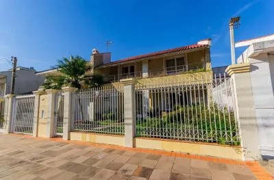 Casa com 4 quartos à venda na rua vinícius de moraes, 363, marechal rondon, canoas por r$ 1.300.000