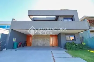 Casa em condomínio fechado com 4 quartos à venda na avenida juca batista, 9000, belém novo, porto alegre, 450 m2 por r$ 3.550.000