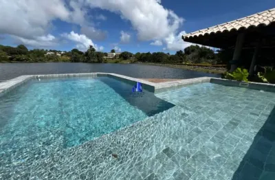 Casa térrea à venda condomínio encontro das águas r$ 10.800.000,00 frente para lagoa, maravilhosa, terreno 4.000 m²,piscina e quiosque vista lagoa