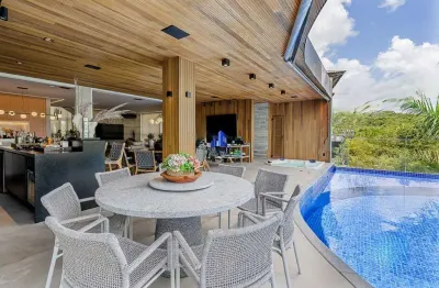 Casa à venda alphaville ii salvador r$ 5.800.000,00 nova, 5/4, suíte máster 40 m², piscina aquecida, ofurô, área gourmet, escritório, brinquedoteca!