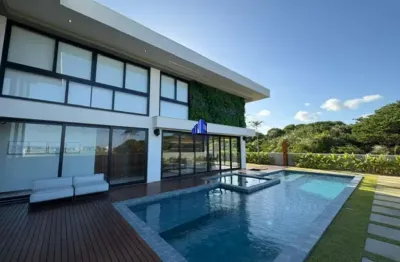 Casa à venda em alphaville guarajuba 1, porteira fechada r$ 12.900.000,00 frente mar, 5 suítes, mobiliada, decorada área gourmet climatizada, piscina