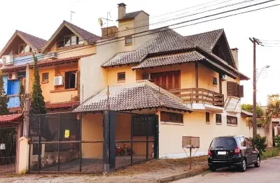 Casa com 3 quartos à venda na rua james bocacio, 216, aberta dos morros, porto alegre por r$ 607.000