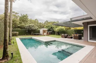 Casa em condomínio fechado com 5 quartos à venda na rodovia doutor antônio luiz moura gonzaga, 95, rio tavares, florianópolis por r$ 7.900.000