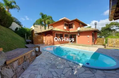 Casa em condomínio fechado com 4 quartos à venda na rodovia doutor antônio luiz moura gonzaga, 39, rio tavares, florianópolis por r$ 2.950.000