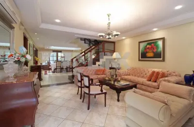 Casa em alto padrão com 4 dormitórios e 4 vagas de garagem à venda no bairro chácara das pedras em poro alegre próxima do shopping iguatemi