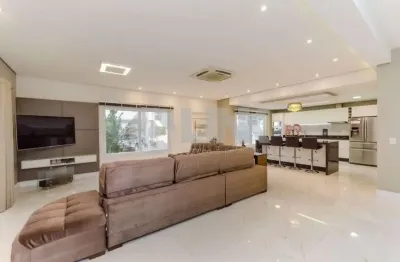 Casa 3 dormitórios 3 suites e 2 vagas de garagem à venda no bairro hípica em porto alegre com infra estrutura próximo da edgar pires e castro