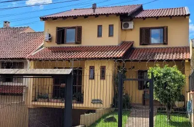 Casa com 3 quartos à venda na rua doutor mário totta, 2812, tristeza, porto alegre por r$ 870.000