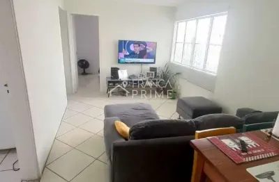 Apartamento de 50m², 2 dormitórios, 2 vagas de garagem, em condomínio fechado.
