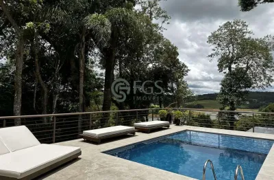 Casa moderna em rua tranquila e com vista espetacular para represa e pôr do sol.